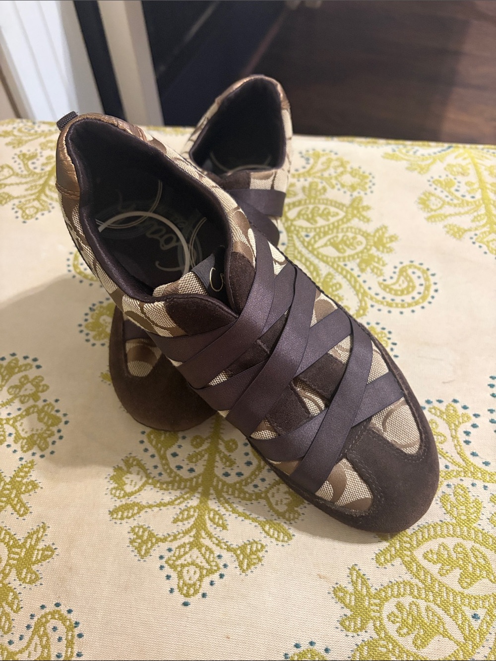 Coach Harmonie Signature Sneakers featuring brown monogram canvas